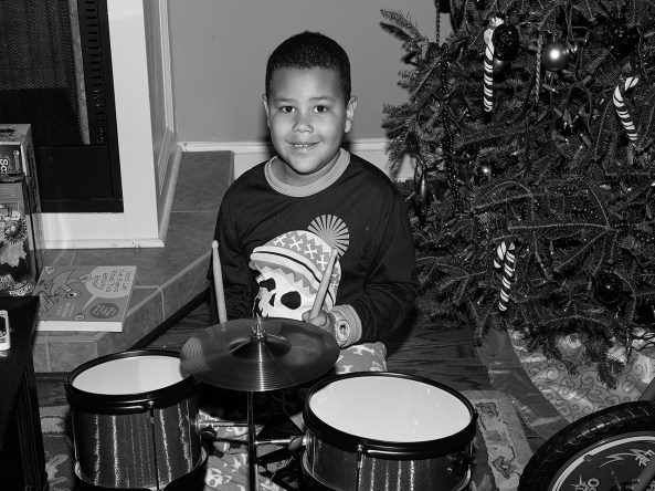 Jordan, my grandson on his new Christmas drum set taken with the Monochrome and the  Leica SF 58 